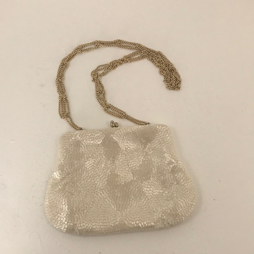 Beaded clutch purse with clamshell opening and chain strap